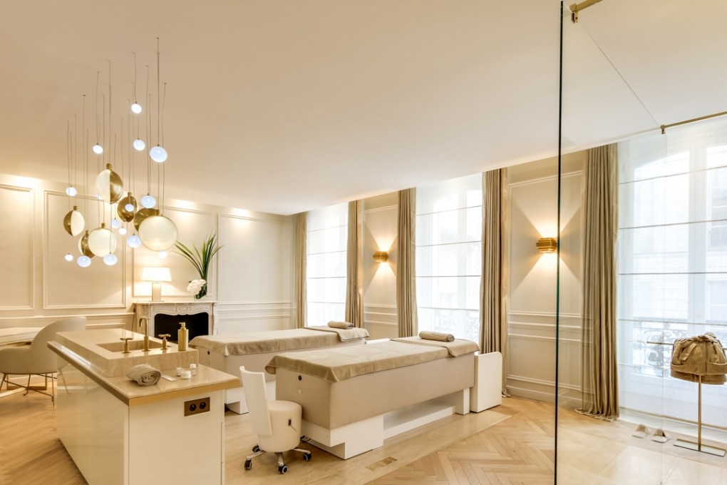 Biologique Recherche’s remodelled therapy rooms in Paris include a striking suspended cluster of hand-blown spherical lights.