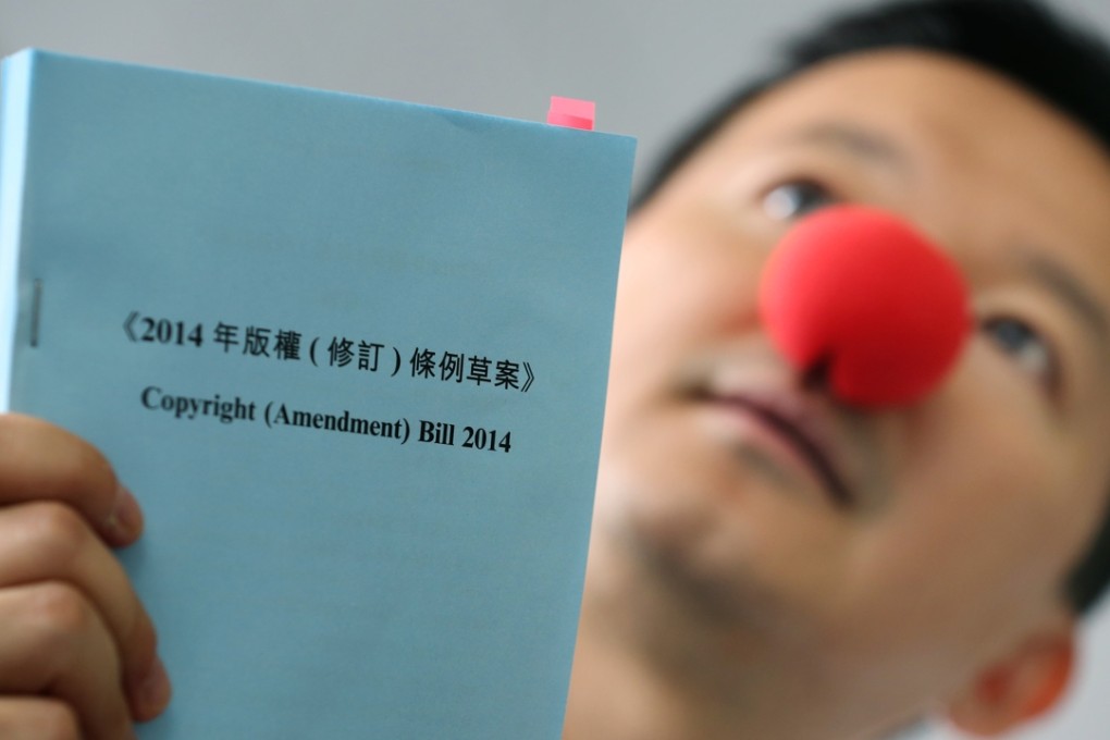 Lawmaker Raymond Chan Chi-chuen holding up a copy of the amendment bill during a protest action held last year. Photo: Nora Tam
