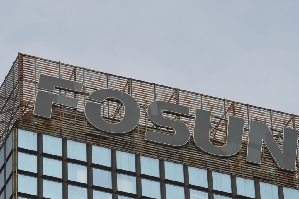 The logo of Chinese conglomerate Fosun is seen on top of a building in Beijing. Trading in its shares were suspended last week when chairman Guo Guangchang disappeared for a day and a half. When trading of the shares resumed on Monday, the share prices sank. Photo: AFP
