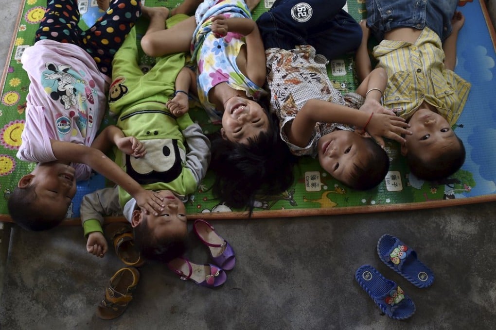 Students preparing to take a nap at Dalu primary school in Hefei, Anhui province. There are currently over 160 students in the school, mostly “left-behind” children whose parents left their hometown to earn a living. Photo: Reuters