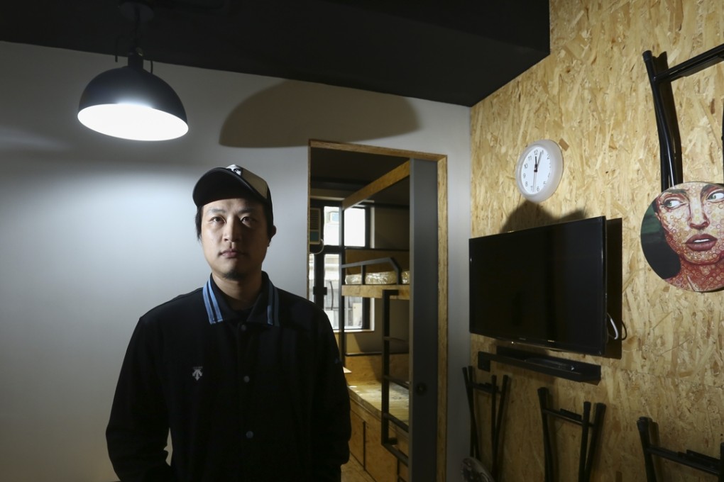 Keith Wong inside the hostel SynBox, which was renovated from an old tenement building in Hung Hom by Wong’s company. Photo: Jonathan Wong