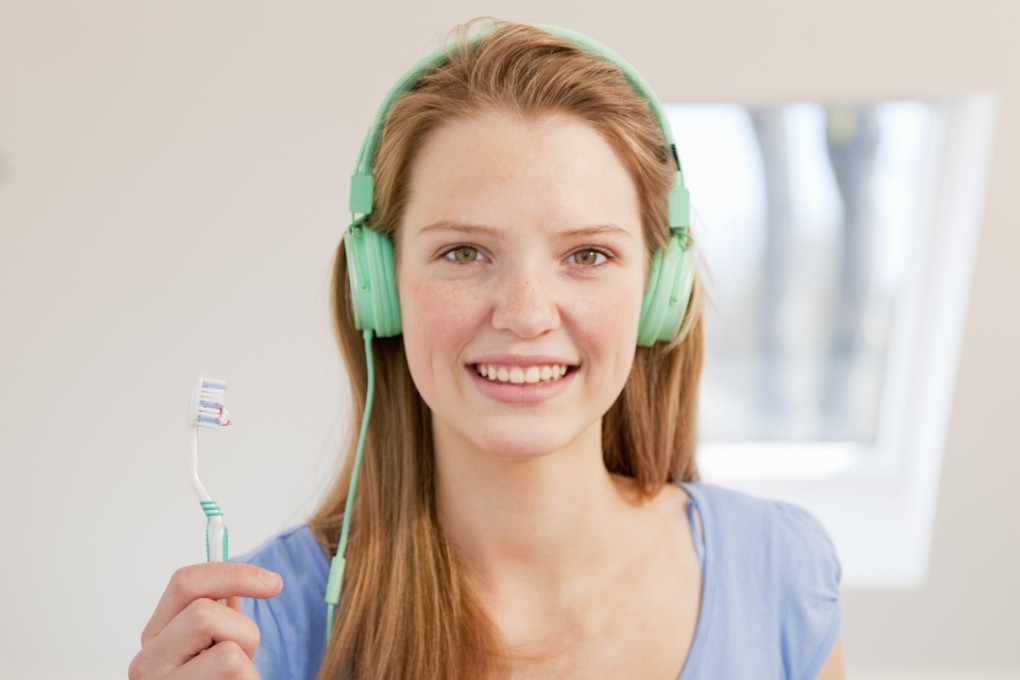 Hearing the sound of your toothbrush against your teeth makes you think you’ve done a good job of brushing. Photo: Corbis