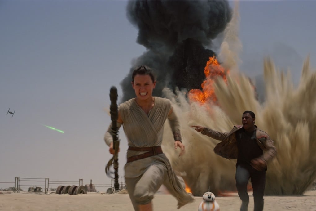 Daisy Ridley, as Rey, and John Boyega, as Finn, in a scene from Star Wars: The Force Awakens (Category IIA). The film, directed by J.J. Abrams, also stars Harrison Ford, Mark Hamill, and Carrie Fisher.