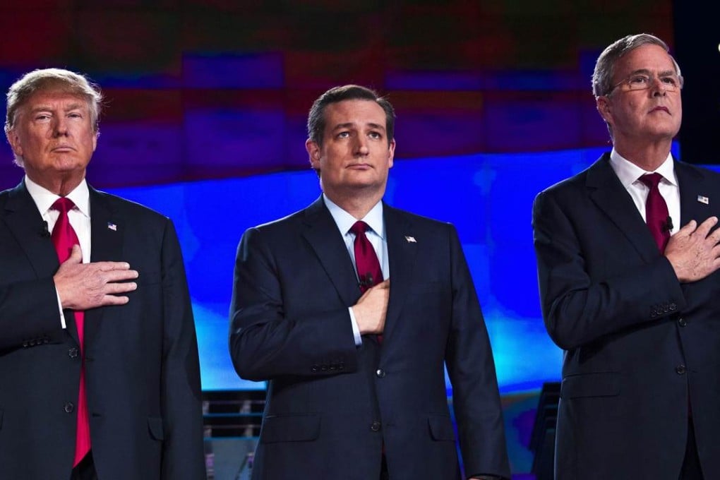 Republican presidential candidates (from left) businessman Donald Trump, Texas Senator. Ted Cruz and former Florida governor Jeb Bush stand on the stage for the US national anthem at the start of the Republican Presidential Debate, hosted by CNN, at The Venetian in Las Vegas. Photo: Agence France-Presse
