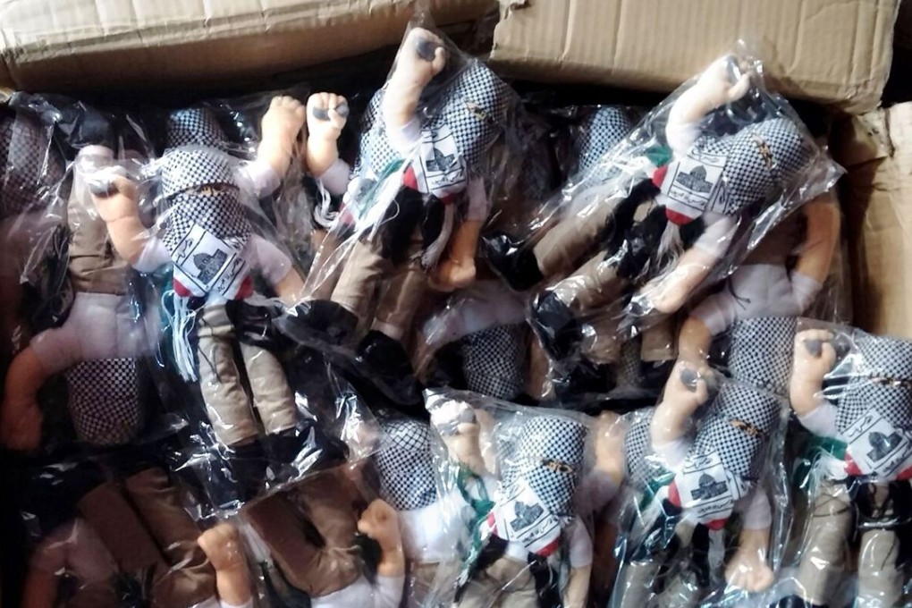A picture provided by Israeli customs authorities shows a box with some of the 4,000 stone-thrower dolls seized recently. Photo: AFP