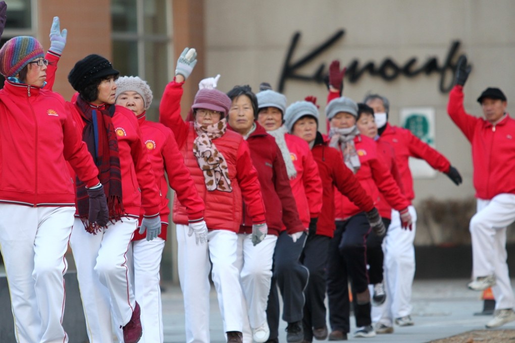 Damas perform a square dance at a residential area in Beijing. Photo: Simon Song