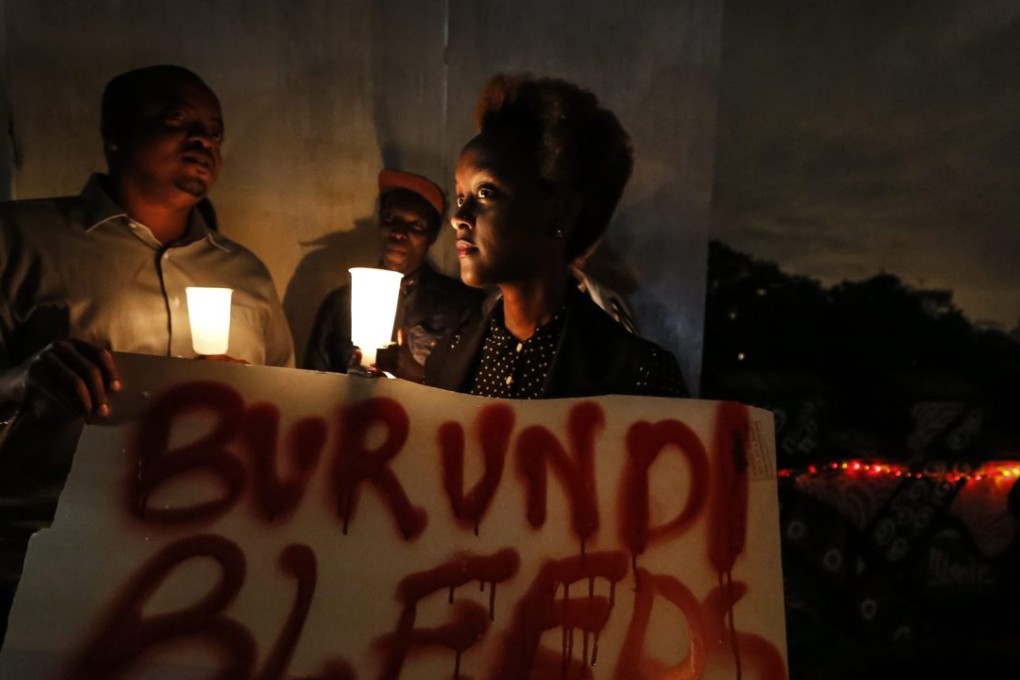 A Burundian attends a candlelight service to call for peace in Burundi. Photo: EPA