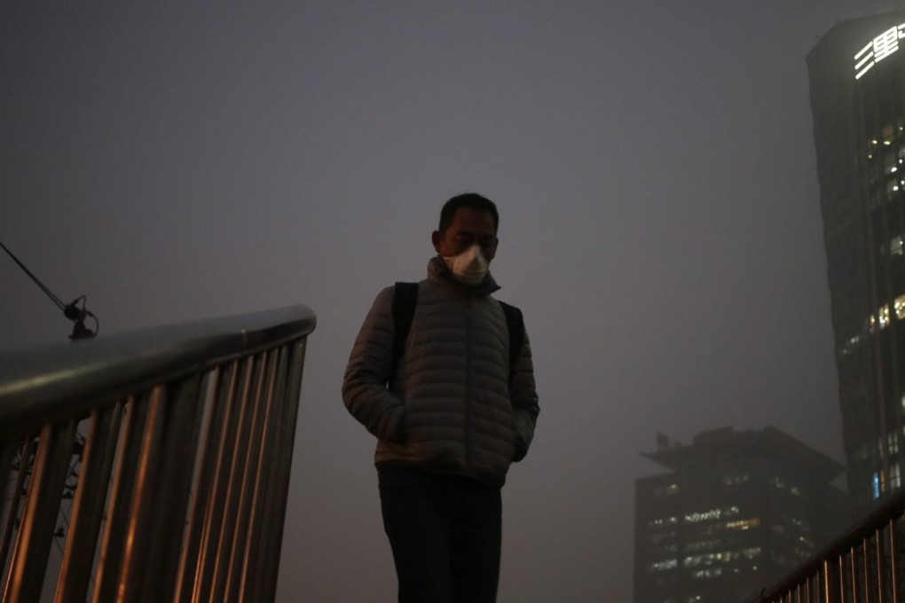 Environment ministry inspections have been stepped up in China after a first red alert over pollution was issued in Beijing as acrid smog shrouded the capital. Photo: EPA