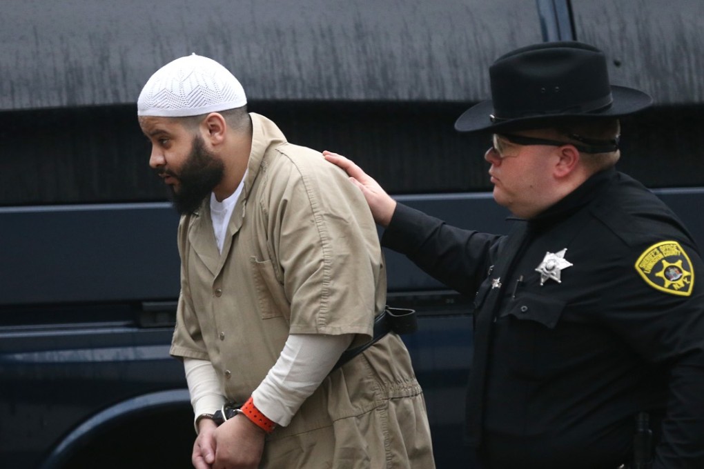 Mufid Elfgeeh is escorted into the Federal Building in Rochester, New York, on Thursday. Photo: AP