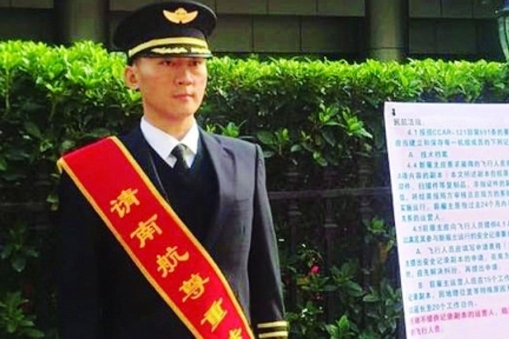 Pilot Liu Yang stands outside China Southern Airlines headquarters hoping that management will accept his resignation. Photo: SCMP Pictures