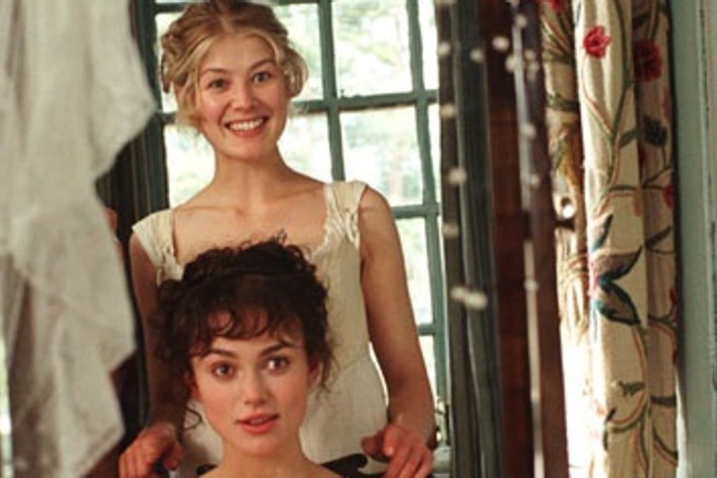Rosamund Pike (standing) and Keira Knightley in the 2005 film adaptation of Pride and Prejudice. Pike reads a new audiobook of the beloved classic.