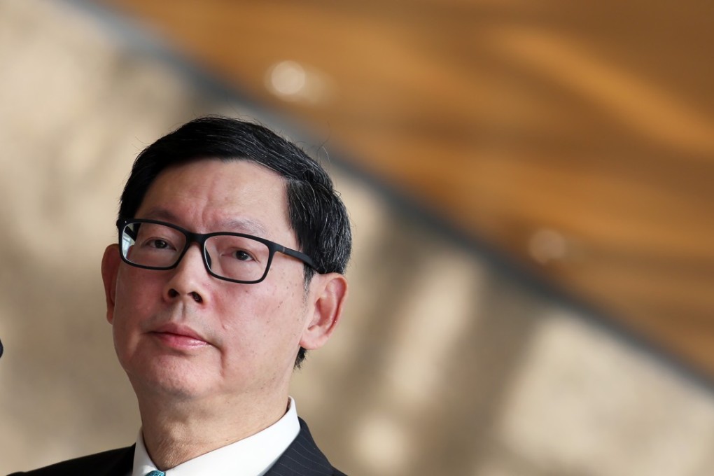 Hong Kong Monetary Authority chief executive Norman Chan says investors need to prepare themselves for shock in stock and property markets. Photo: Nora Tam