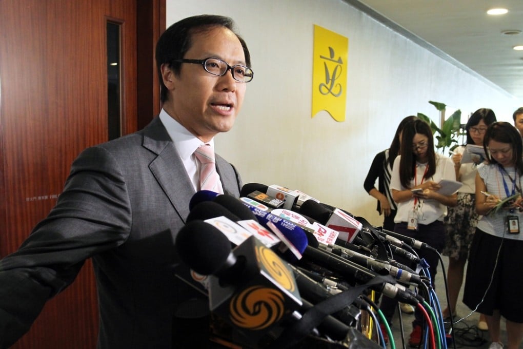 Legislator Kenneth Leung Kai-cheong talks to the press at the Legco Complex in Tamar. 19JUN15