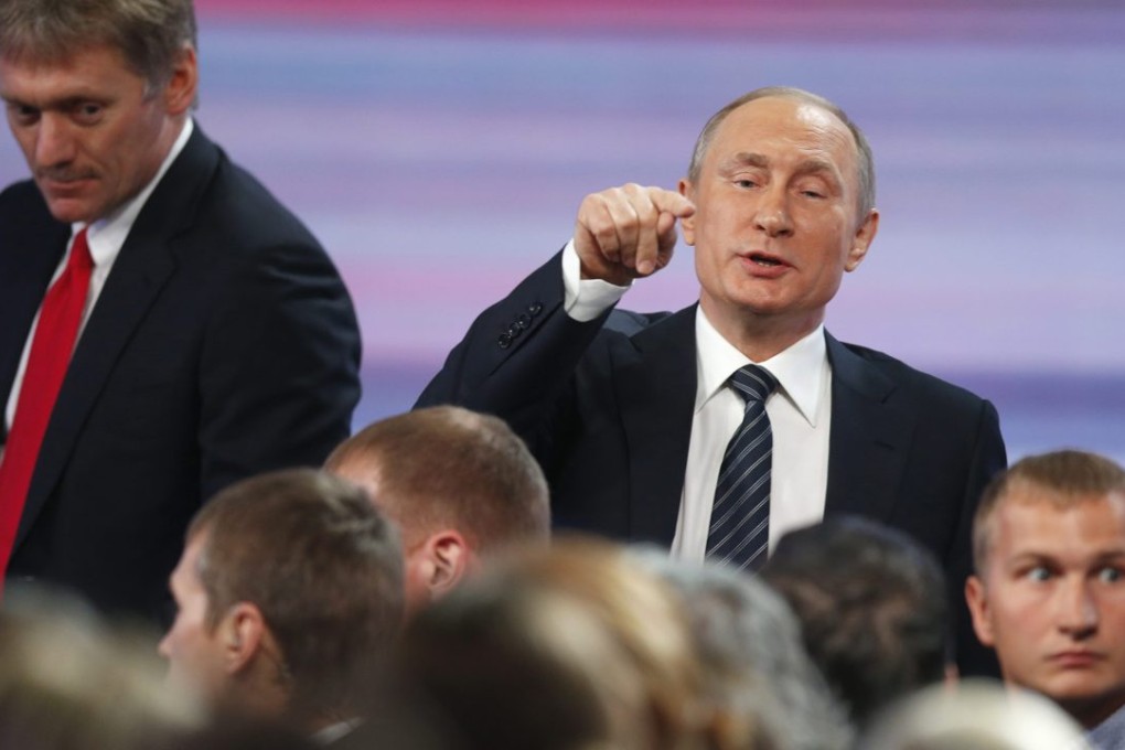 epa05072521 Russian President Vladimir Putin (R) and his press Secretary Dmitry Peskov (L) leave after Putin's annual news conference at the World Trade Center in Moscow, Russia, 17 December 2015. He was expected to address questions on domestic and international issues, especially Russia's involvement in Syria and Ukraine, and its fight against international terrorism. EPA/YURI KOCHETKOV