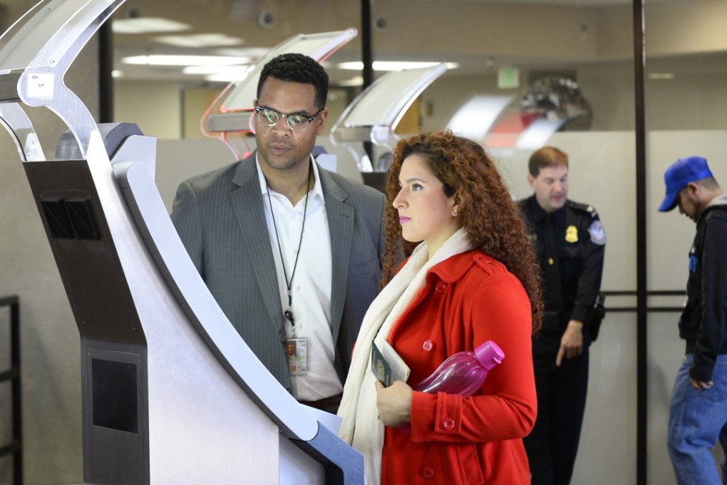 People use a biometric kiosk at the Otay Mesa port of entry in San Diego. Photo: AP