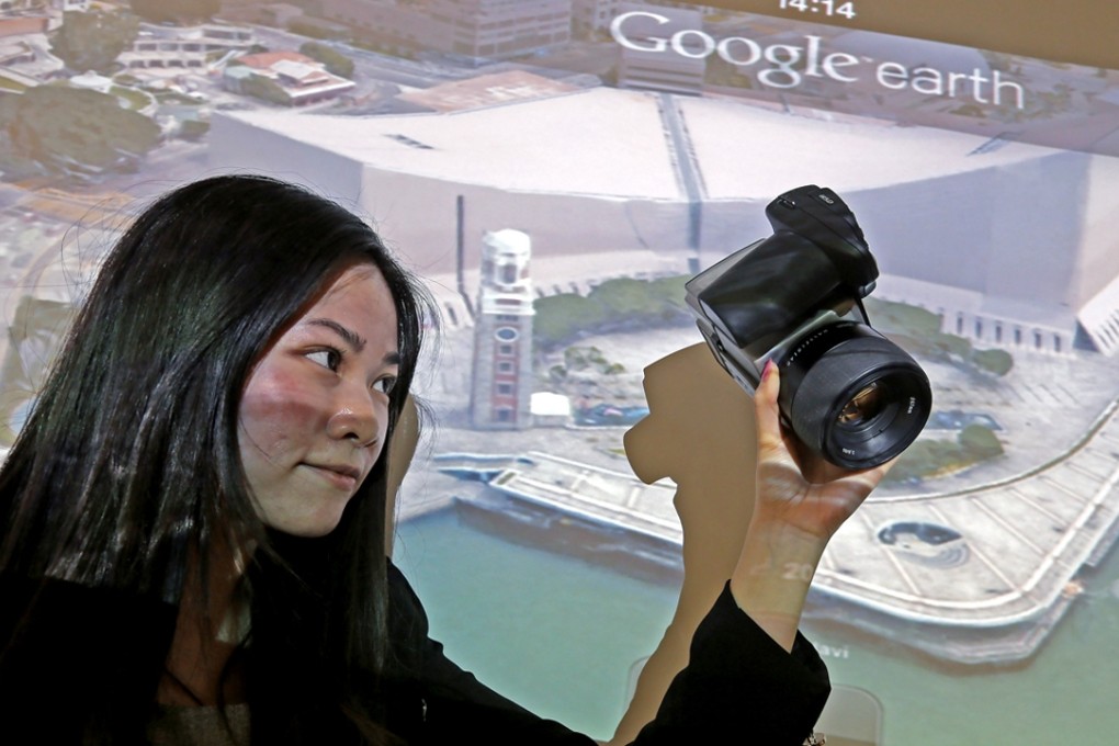 Cindy Law, production support officer of DIMAP HK PTY ltd, speaks about Google’s 3D mapping of Hong Kong. Photo: Dickson Lee