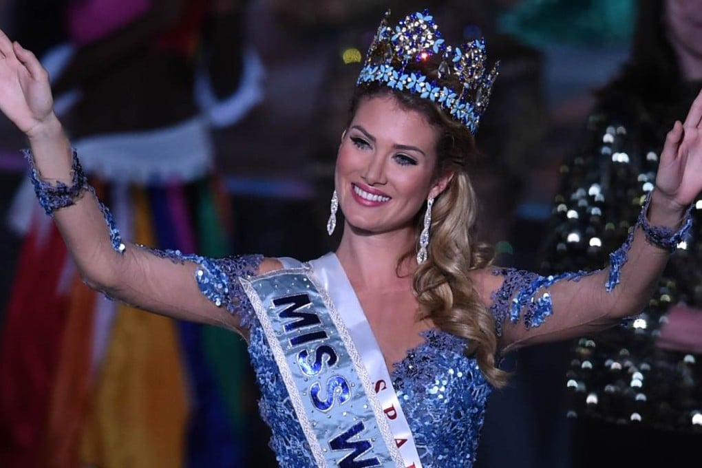 Mireia Lalaguna Rozo of Spain waves after winning Miss World in Sanya, in southern China's Hainan province. Contestants from more than 110 countries competed in the final. Photo: AFP
