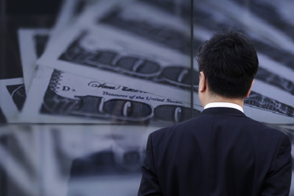 A courier would take delivery of an entire suitcase of US$100 bills in exchange for a receipt with a chop stamp. Photo: Reuters