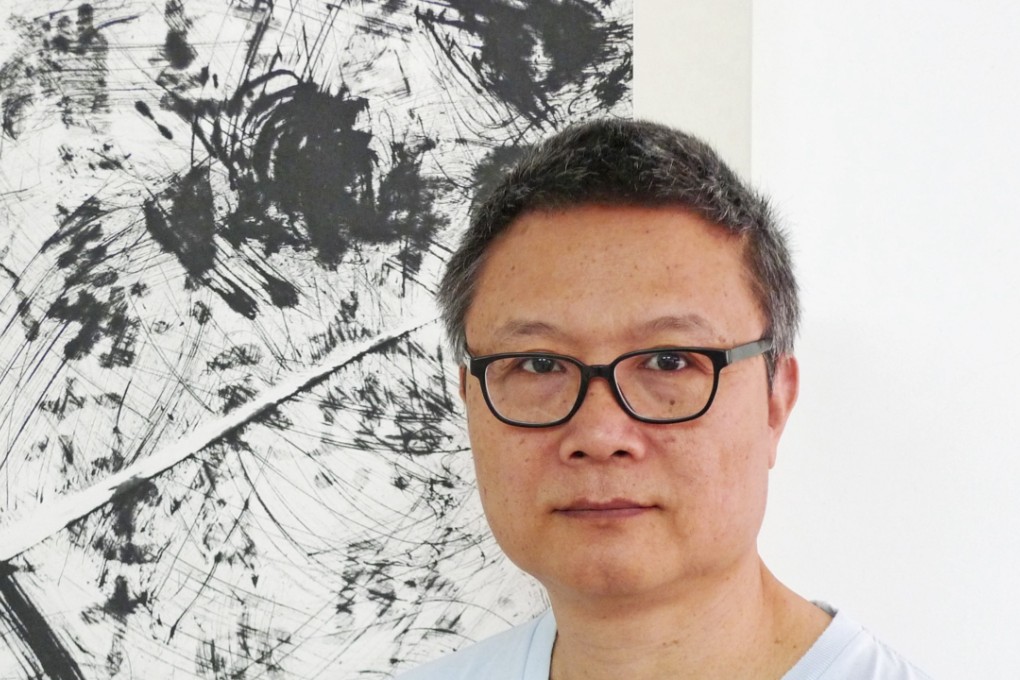 Fung Ming Chip with one of his works at Galerie du Monde.