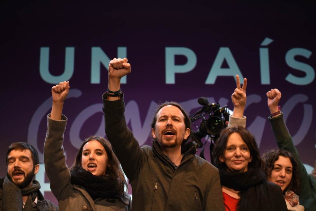 Podemos leader Pablo Iglesias (centre) celebrates his party’s strong showing in Sunday’s election at the party’s headquarters in Madrid. Photo: AFP