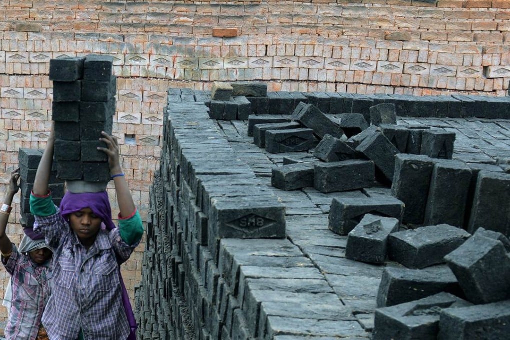 Indian labourers work at a brick manufacturing unit on the outskirts of Hyderabad. China can help India to build infrastructure and set up manufacturing facilities, where China has considerable expertise. Photo: AFP