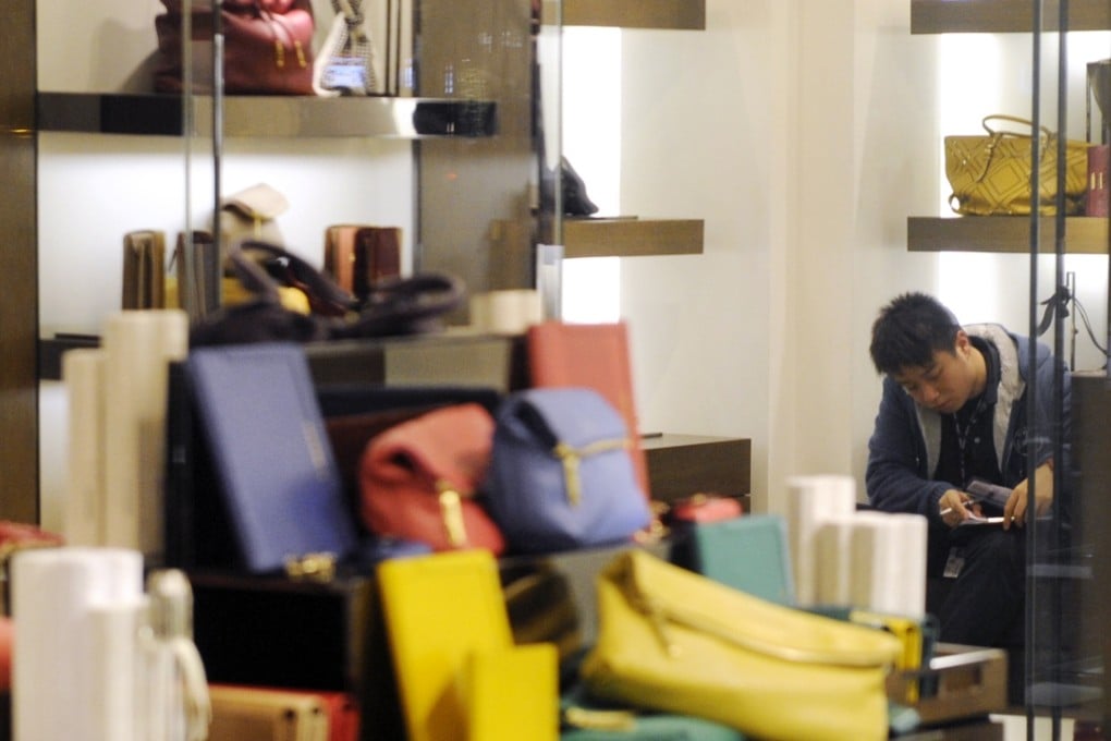 Police investigate a shoplifting incident in Tsim Sha Tsui. Photo: SCMP Pictures