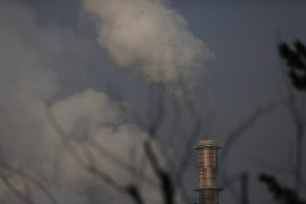 Smoke is seen emitting from a funnel from a thermal power plant on a hazy day on the outskirts of Beijing. Photo: EPA