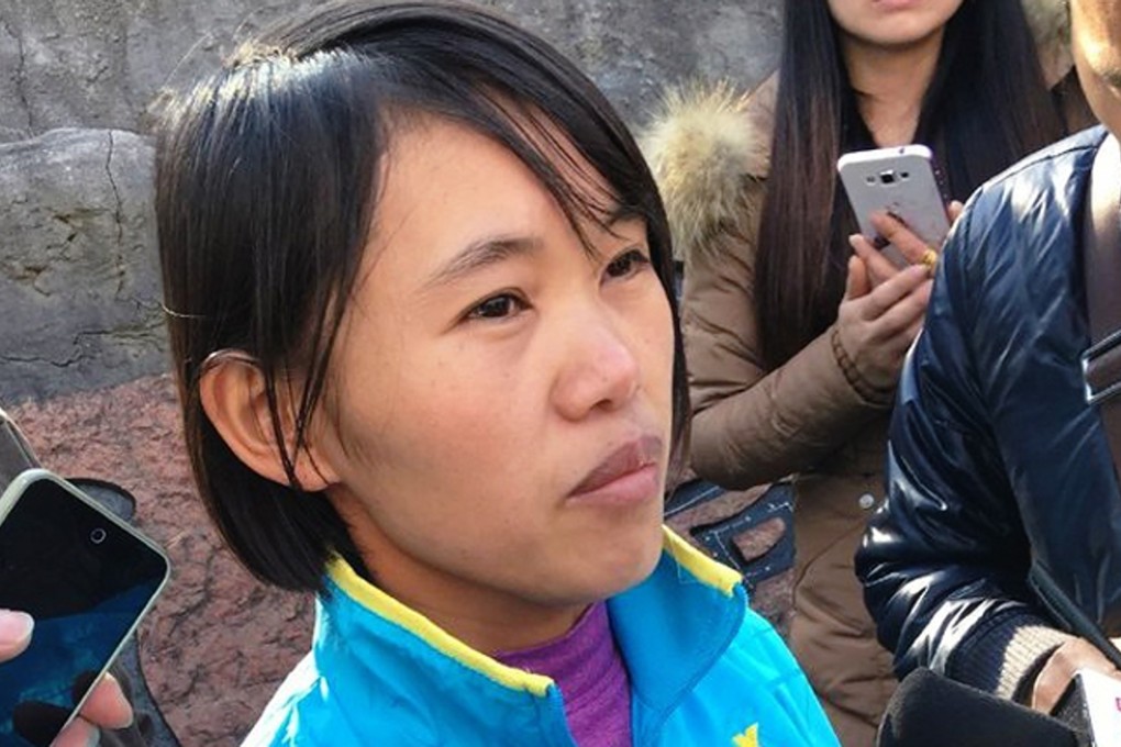 Free at last. Qian Renfeng speaks to reporters following her successful appeal against a life sentence. Photo: Yn.people.cn