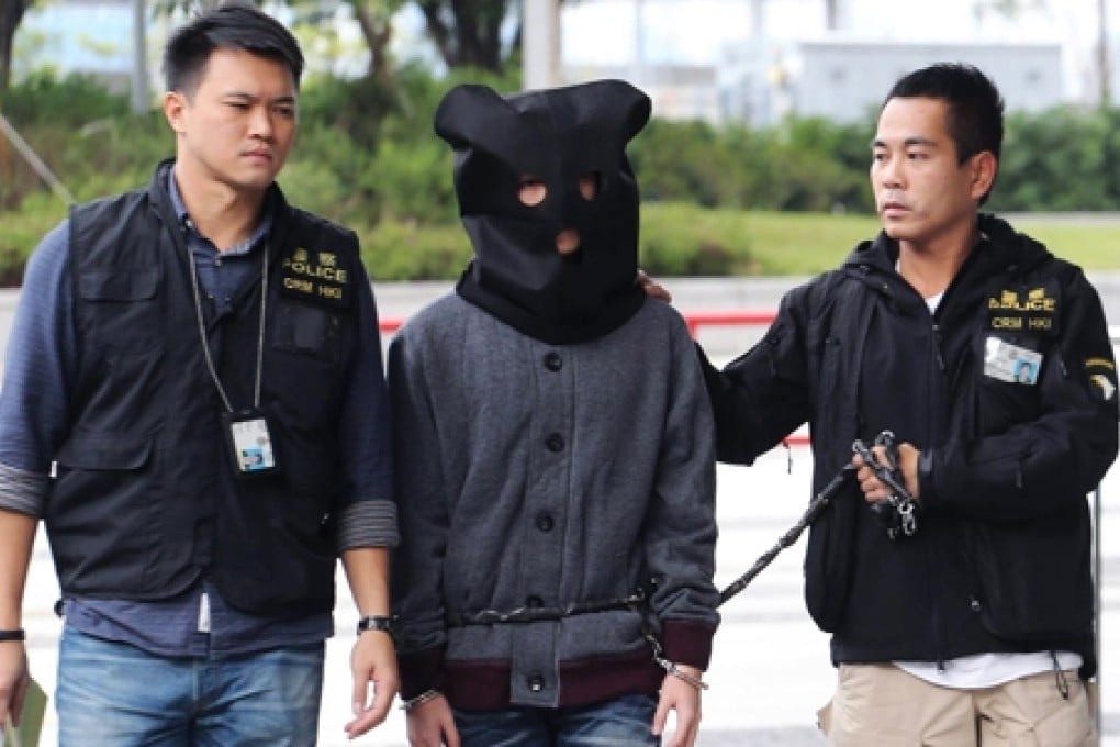 Police bringing one of the suspects back to Legco today. Photo: Felix Wong