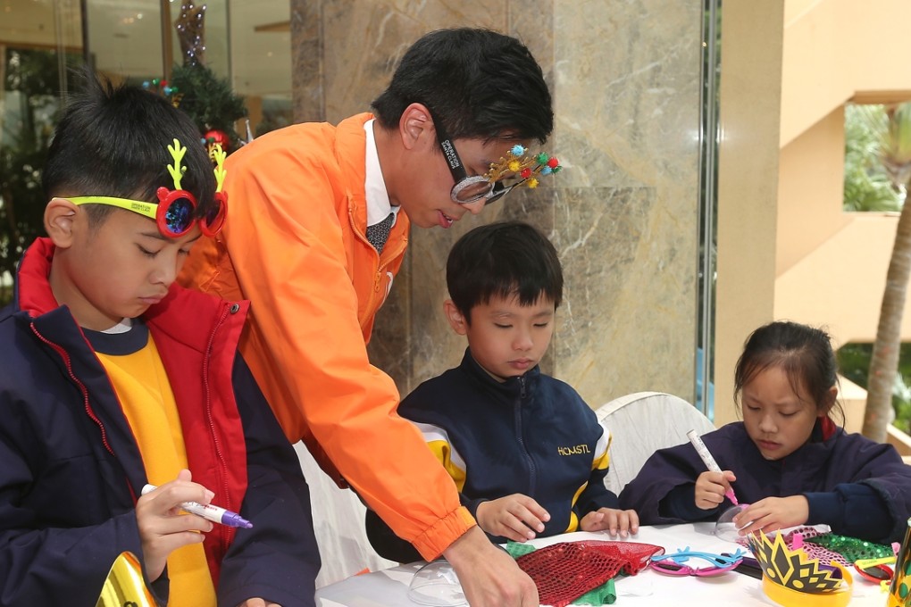 Students from Hong Chi Morninghill School were treated to a buffet lunch and handicraft activity at the Hong Kong Gold Coast Hotel. Photo: K. Y. Cheng