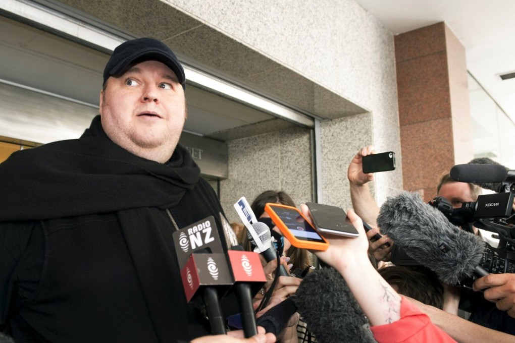 Kim Dotcom faces the press outside an Auckland courthouse on Wednesday. Photo: Reuters