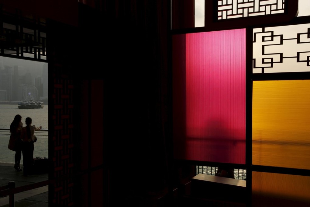 A file photo showing shoppers framed by a Chinese decoration that have been put up in preparation for the Lunar Chinese New Year at a shopping mall in Hong Kong on January 27. Photo: Reuters