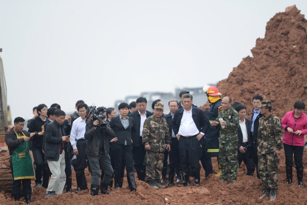 Ma Xingrui (front, third right), the municipal party secretary of Shenzhen, and other officials visit the site of the landslide in the southern city on December 21. Photo: Reuters