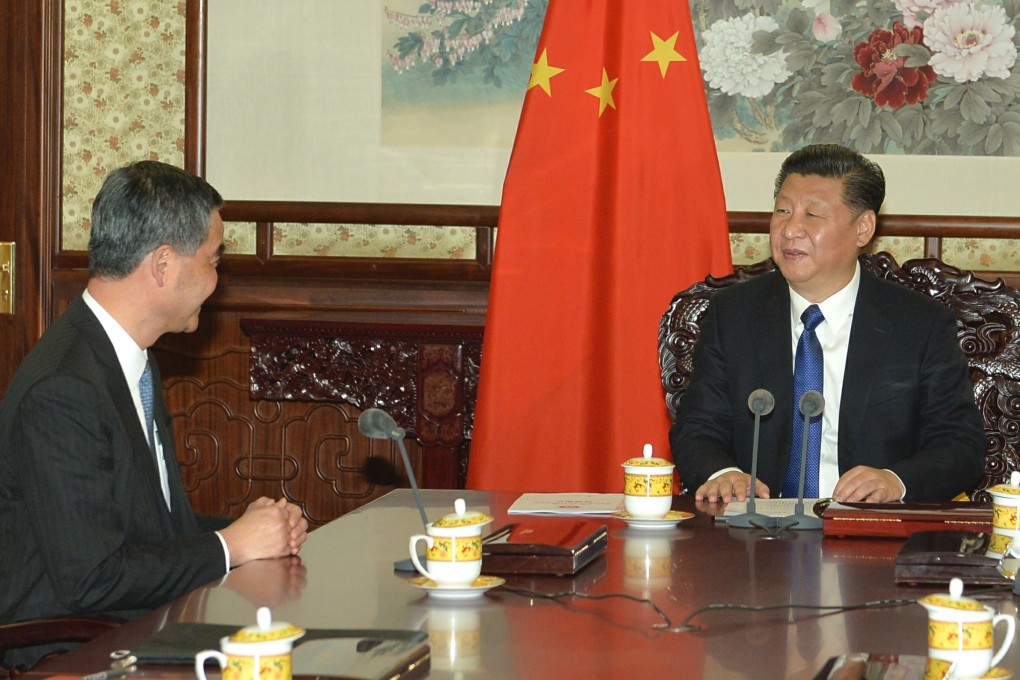 CY Leung (left) briefs President Xi Jinping (right) on the latest economic, social and political developments in Hong Kong. Photo: SCMP Pictures