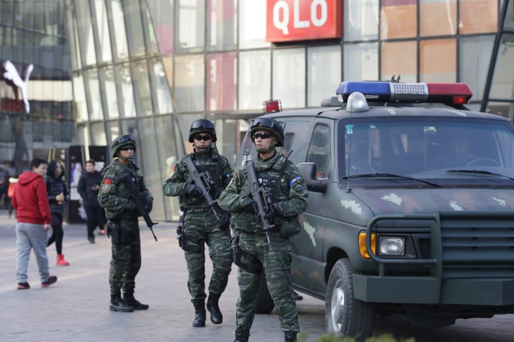 Leaving nothing to chance, armed Beijing police from the Snow Leopard Commando Unit patrol Sanlitun streets. Photo: Reuters.