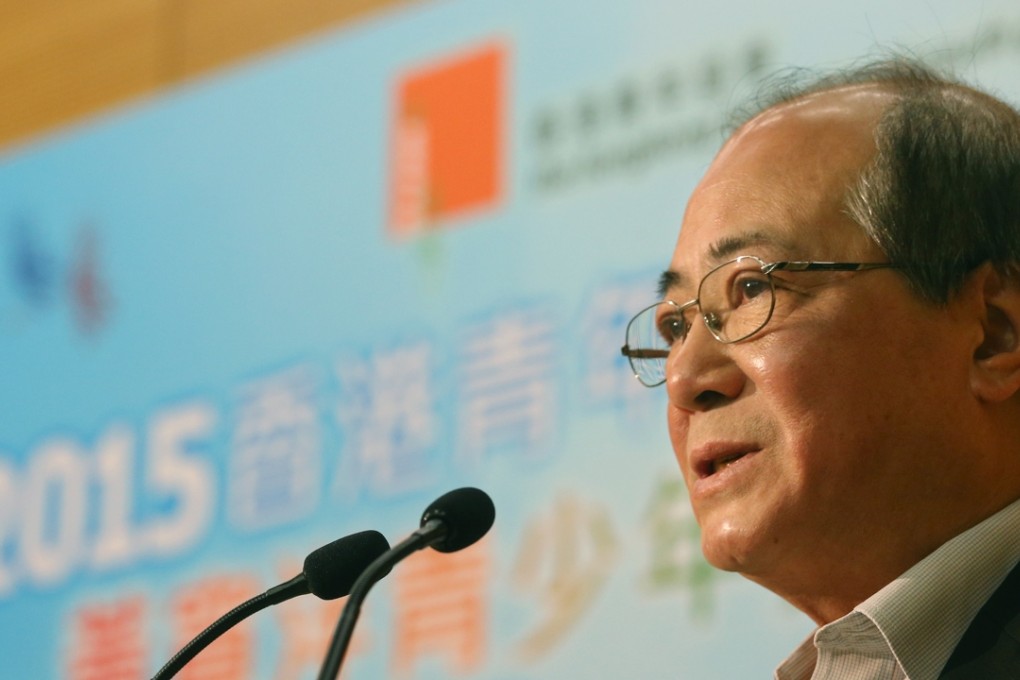 Education minister Eddie Ng Hak-kim was allegedly stalked by two Apple Daily reporters