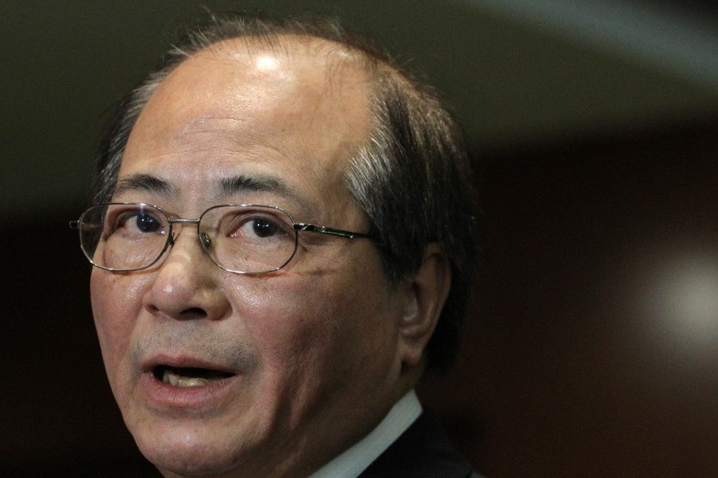 Eddie Ng Hak-kim, Secretary for Education, speaks to reporters in Legislative Council,.