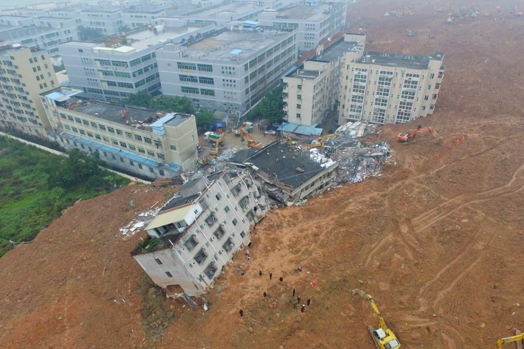 Diggers removing soil and debris at the scene of the disaster. Photo: Xinhua
