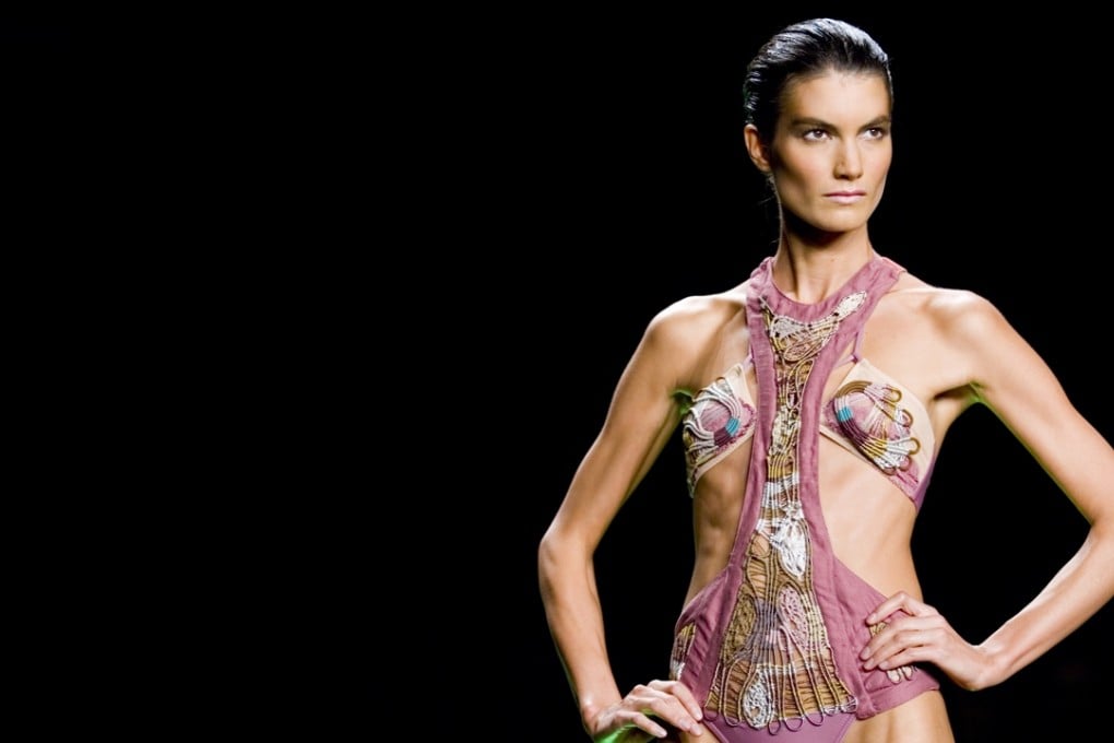 A model on the runway. Health experts are asking for action to be taken against the very thinnest models. Photo: Corbis
