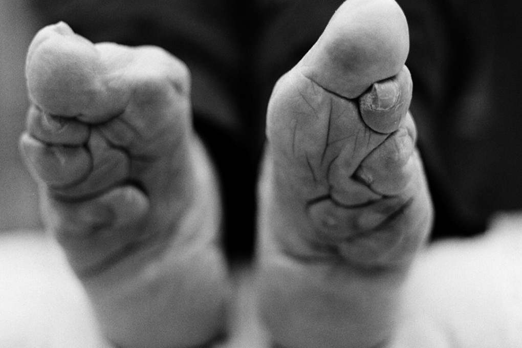 An image from Jo Farrell’s book shows the feet of Yang Jinge, 87. Photo: Jo Farrell