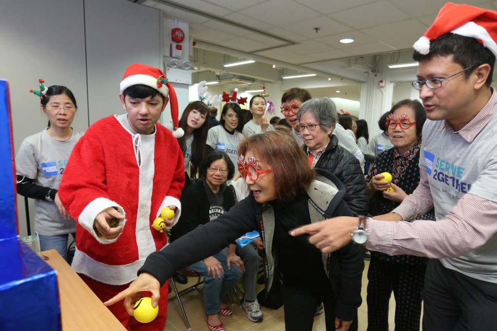 American Express staff members paying a holiday visit to Chung Hok Elderly Centre in Sheung Wan. Photo: Dickson Lee