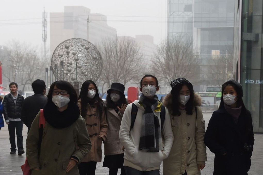 Women wearing face masks on a heavily polluted day in Beijing. Photo: AFP