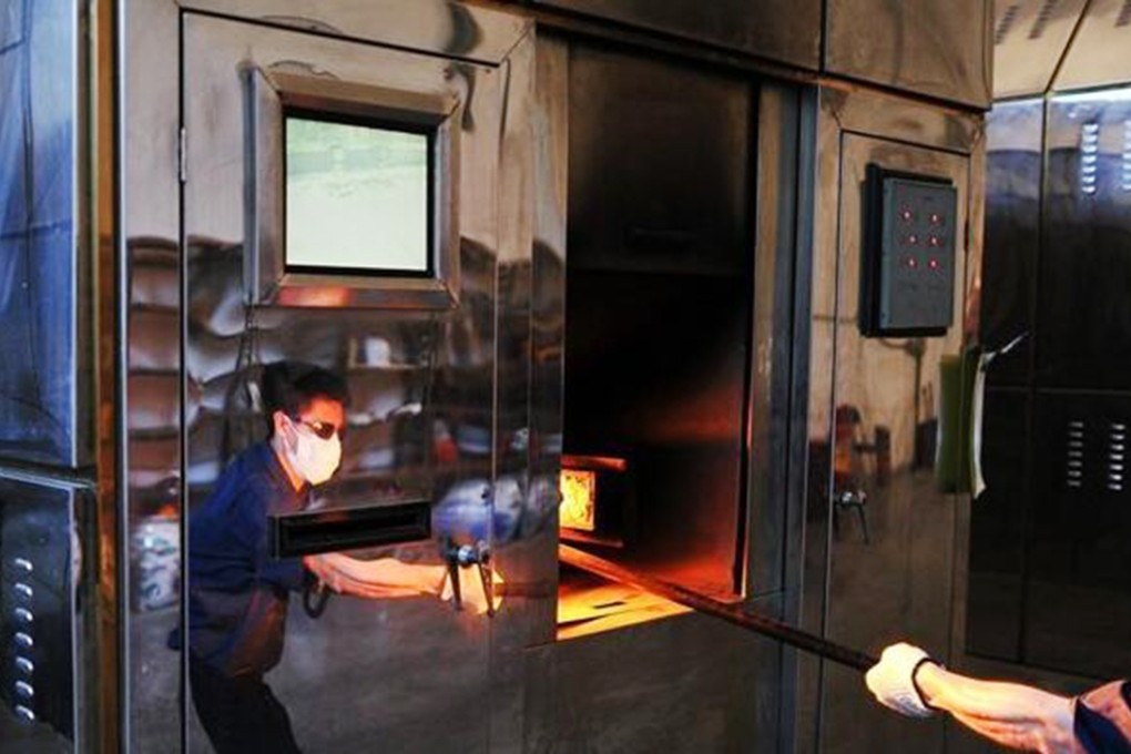 The National Cremation Skills Competition drew 54 industry professionals, who were assessed on their practical skills and grasp of theory. Above, a crematorium operator. Photo: SCMP Pictures