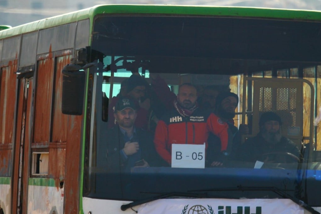 Fighters and civilians being evacuated from two besieged areas in Syria on Monday under a deal between warring parties backed by the United Nations. Photo: Reuters