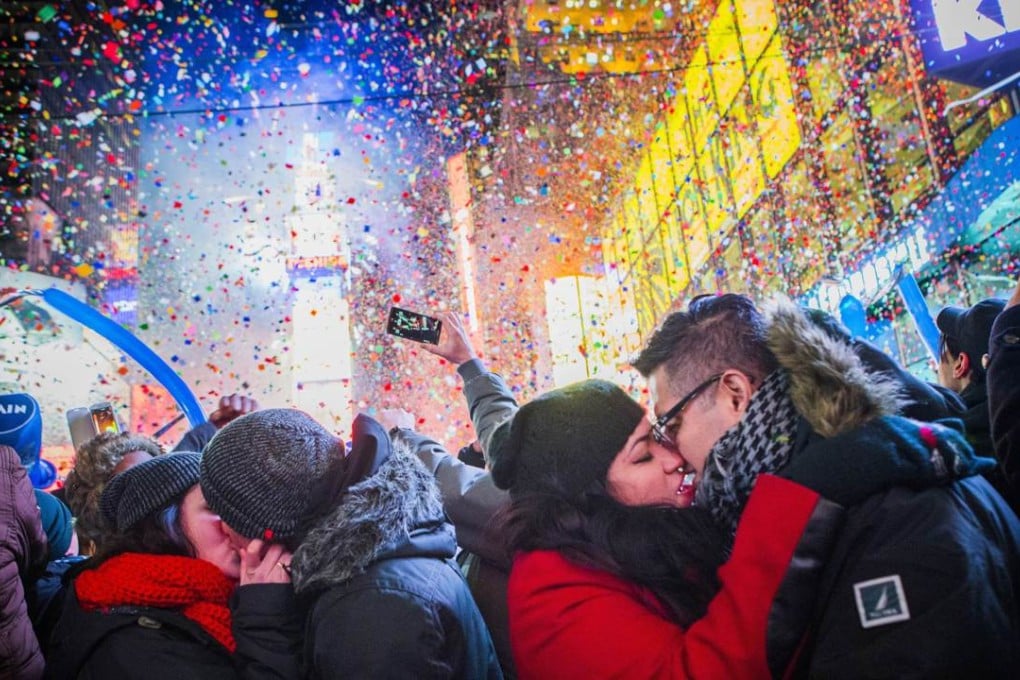 Couples kiss in Times Square during 2013 New Year’s celebrations. Security has been boosted for this year’s party. Photo: AFP