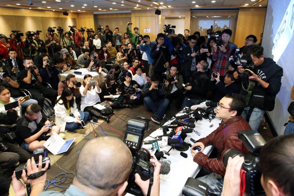 PR man Ben Lam Tsz -pan tells the assembled media the press conference has been cancelled. Photo: SCMP Pictures