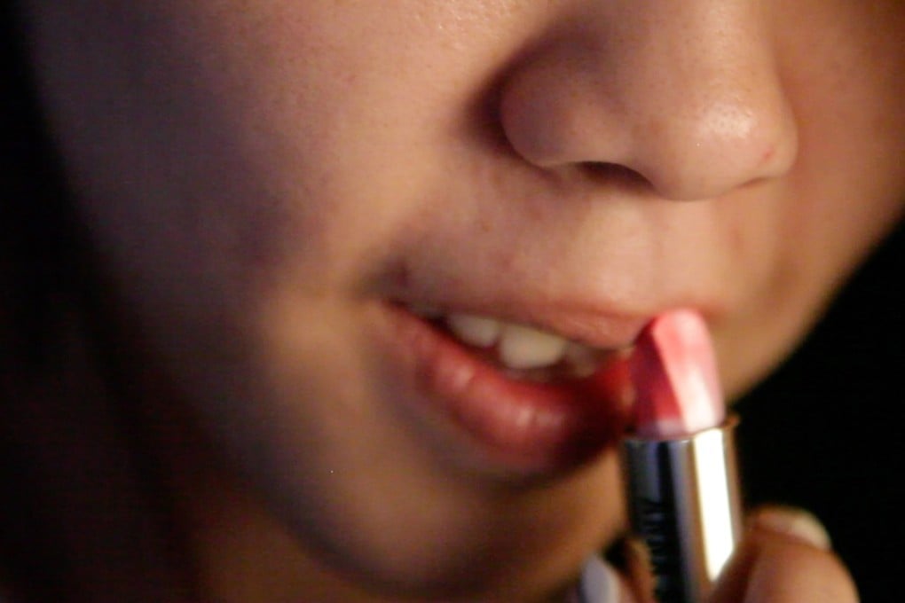 ‘Hikaru’ puts on lipstick in her aunt’s house. Photo: Vicky Feng