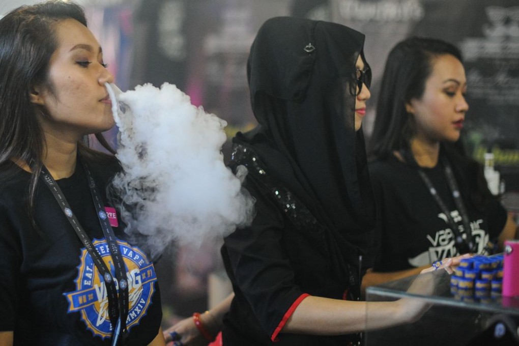 Vaping" is soaring in popularity in Malaysia, the largest e-cigarette market in the Asia-Pacific region, but authorities are threatening to ban the habit in for health reasons. Photo: AFP
