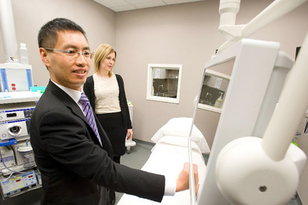 Dr. Andrew Chan and manager Natalie Waters give a tour of The Endoscopy Centre during an open house inside the Charlotte Medical Arts Clinic . Photo: QMI Agency