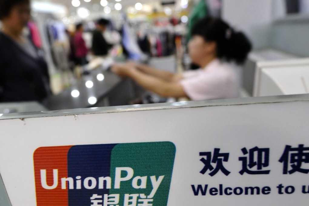 The logo of Chinese bank card operator UnionPay is seen at a cashier at a shopping mall in Changzhi, Shanxi province, China. Photo: Reuters